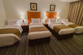 Al Massa Grand Hotel - Luxury room interior with Haram view, premium Umrah accommodation facilities and amenities