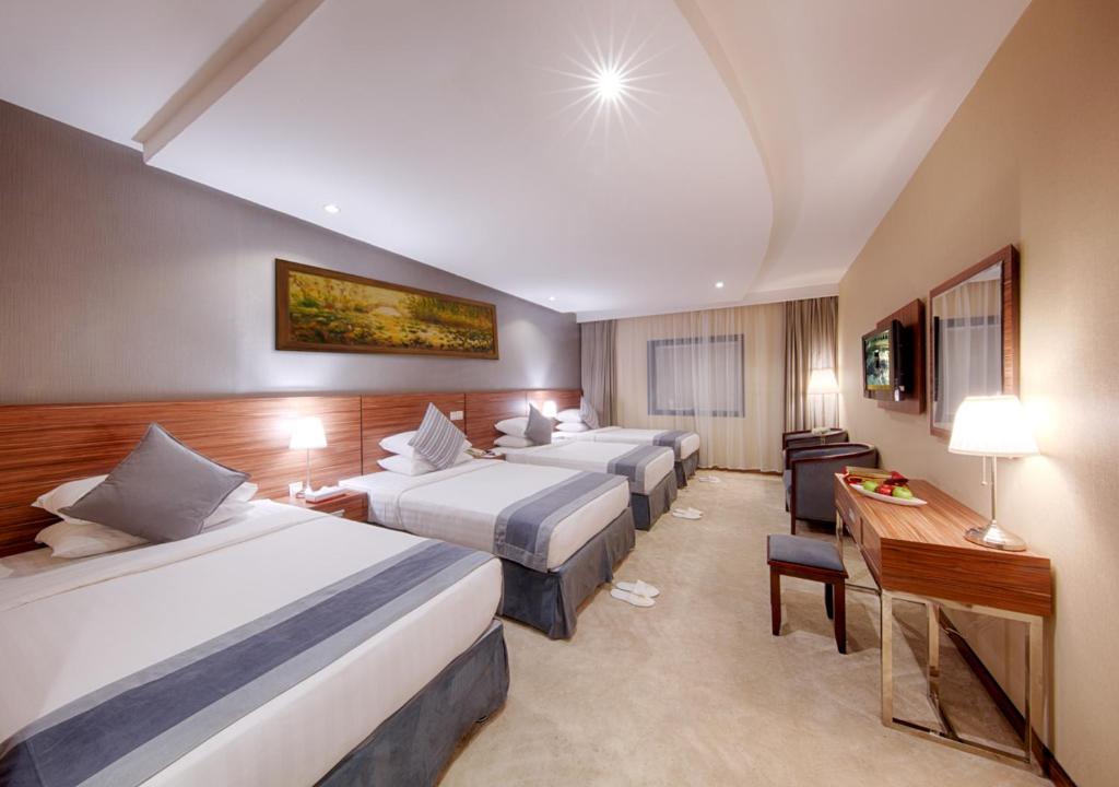 Al Safwah Royale Orchid - Luxury room interior with Haram view, premium Umrah accommodation facilities and amenities