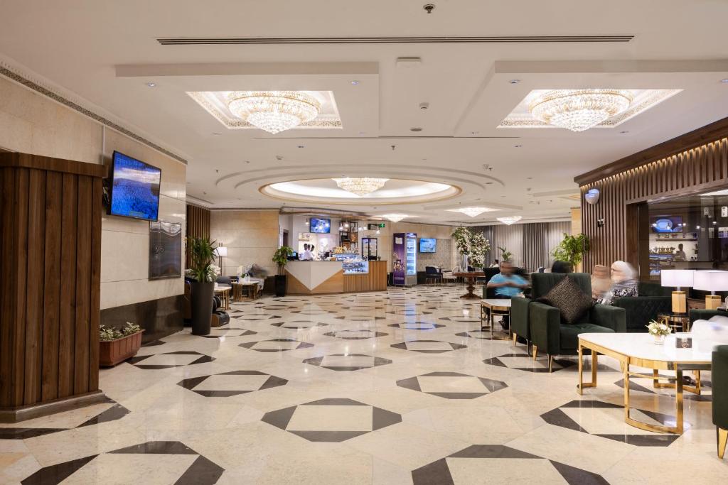 Emaar Grand Hotel Mecca - Luxury room interior with Haram view, premium Umrah accommodation facilities and amenities