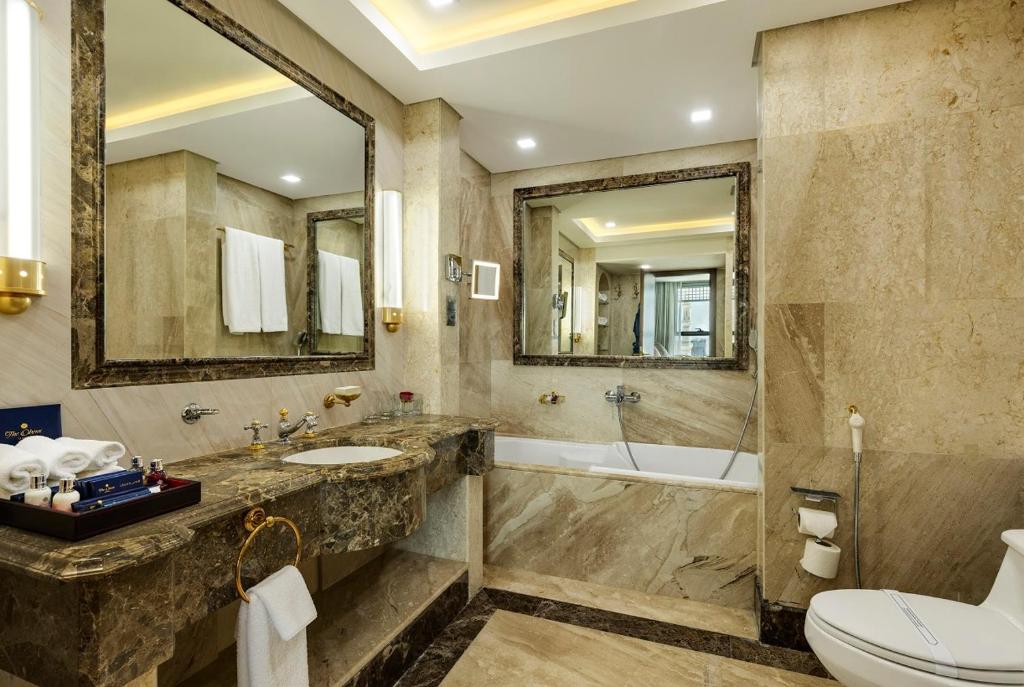 The Oberoi Madina - Deluxe hotel room interior near Masjid Nabawi, Islamic heritage accommodation amenities